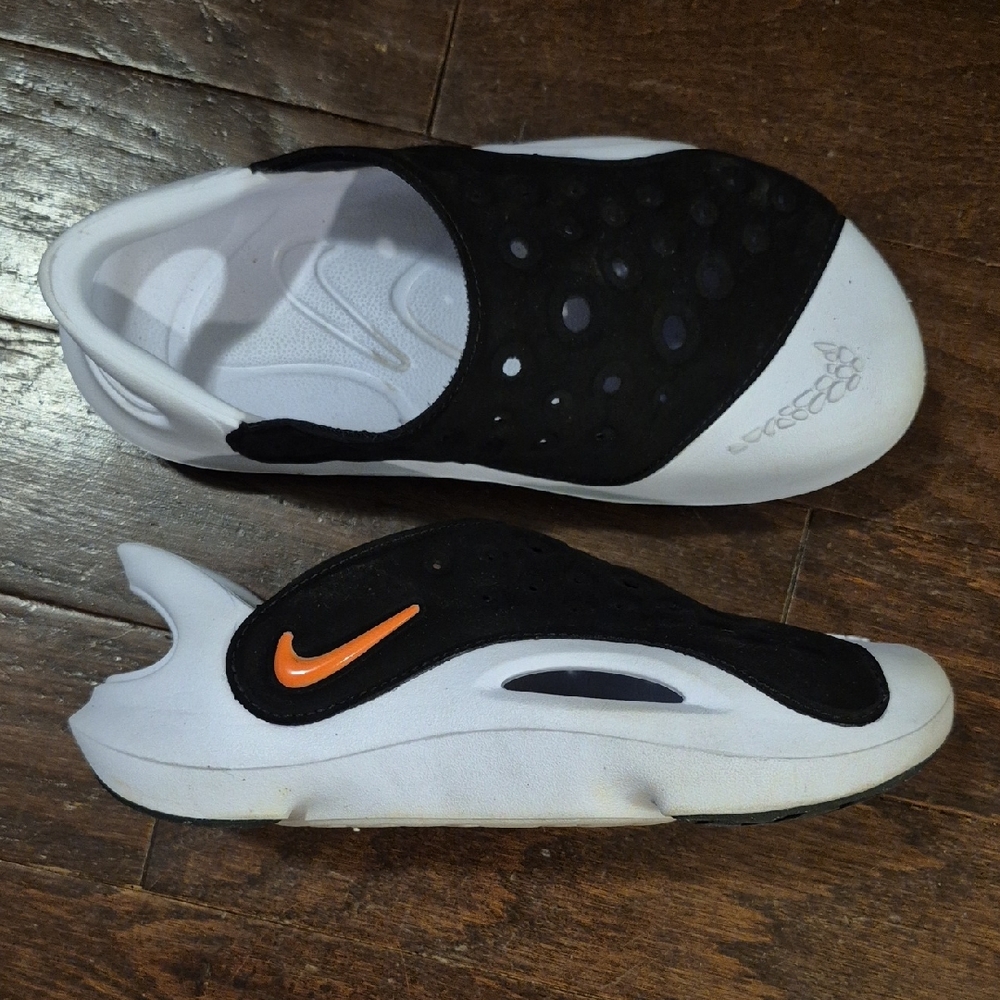 Nike Black and White Slip-Ons with Orange Accent